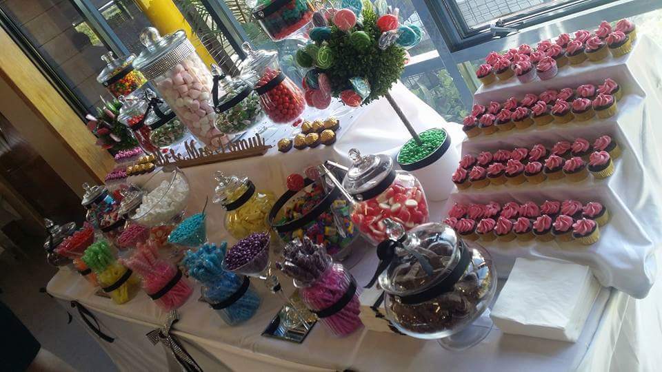 Table Filled With Cakes And Chocolates